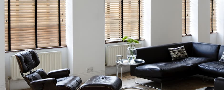 Wooden blinds with dark tapes