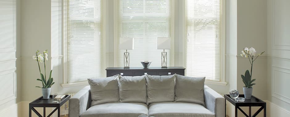 Cream wooden blinds in living room