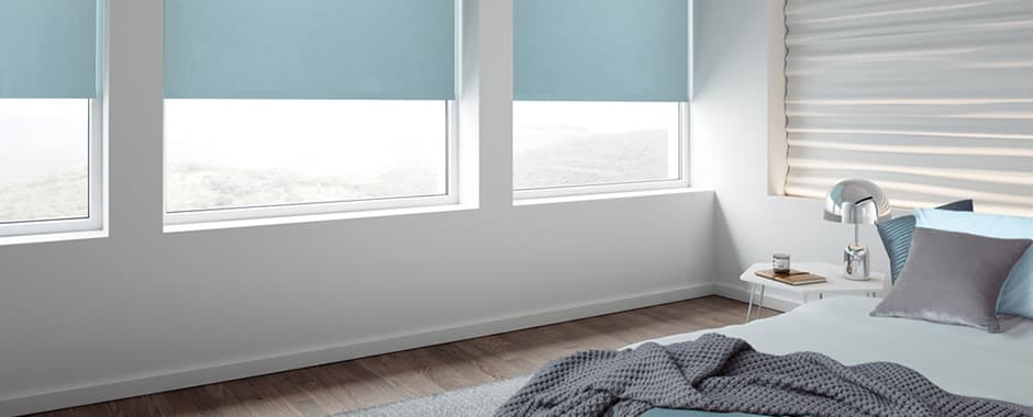 Blue blackout blinds in bedroom