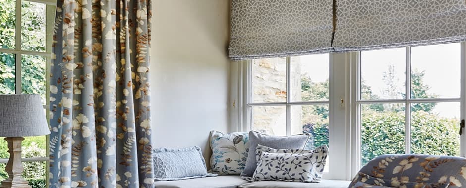 Silver grey patterned roman blinds living room