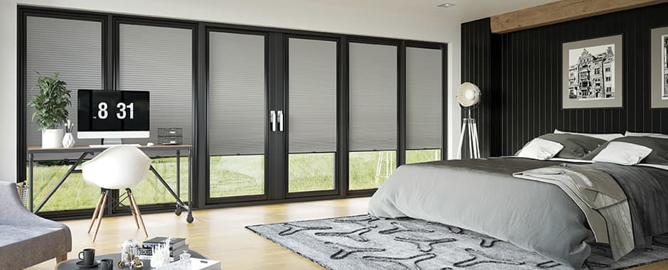 Grey perfect fit pleated blinds on bifold doors