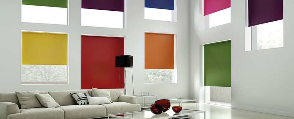 Colourful collection of roller blinds in living room