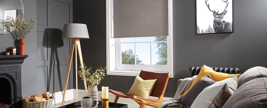 Light brown made to measure blackout roller blinds in grey living room