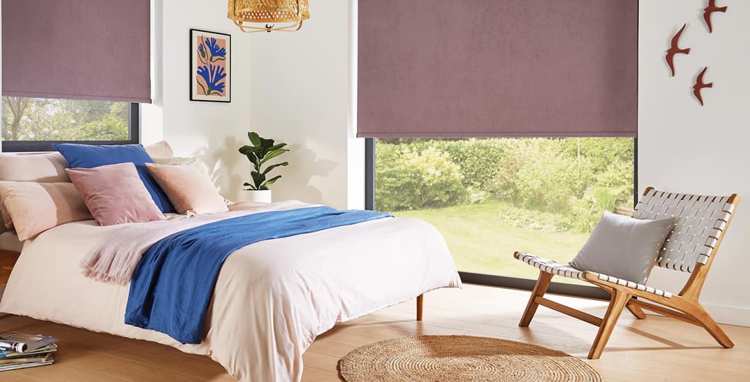 https://www.englishblinds.co.uk/blog/wp-content/uploads/2022/01/luxury-heather-blackout-roller-blinds-in-bedroom.jpg