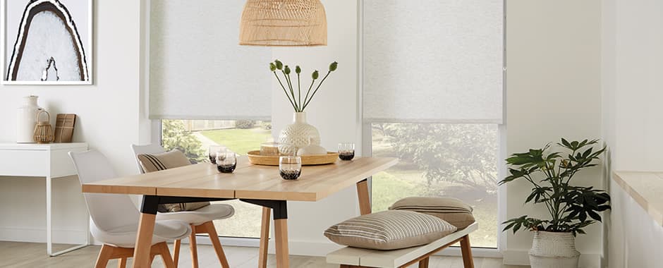 White roller blinds in large dining room