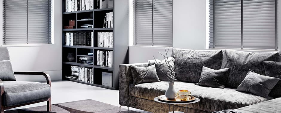 Grey wooden blinds with tapes in modern living room