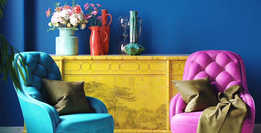 Colourful chairs and yellow sideboard 