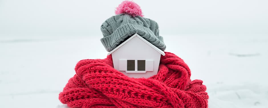 Insulated home wrapped in hat and scarf