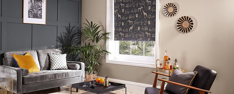 Black and gold safari animals patterned roller blinds in lounge