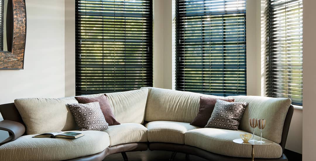 Black wooden blinds in living room