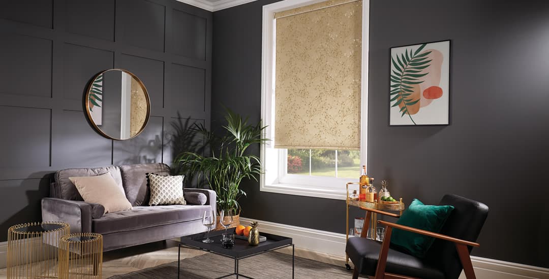 Gold leaves patterned roller blind in dark living room