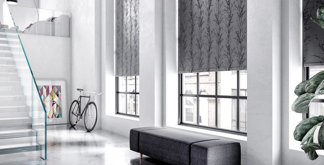 Lustrous silver and grey trees and grasses patterned roller blinds