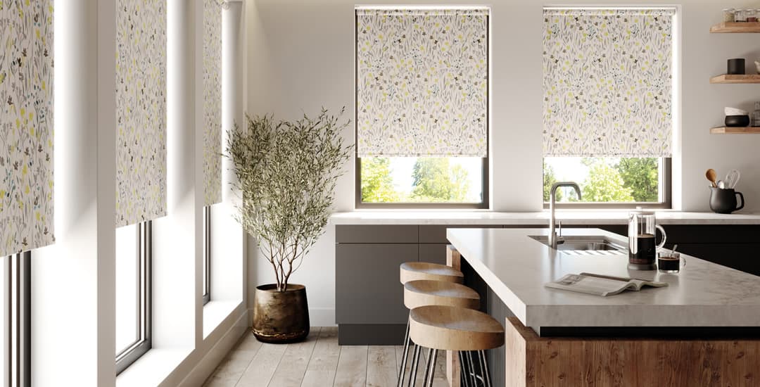 Yellow, green & cream floral patterned roller blinds in modern kitchen