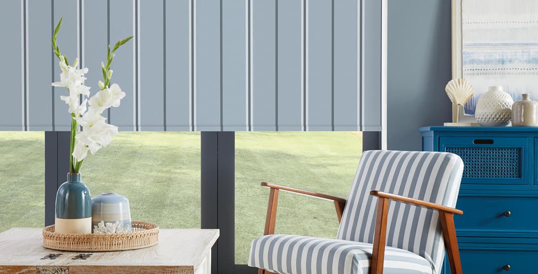 Blue and white vertical striped blackout roller blinds sitting room