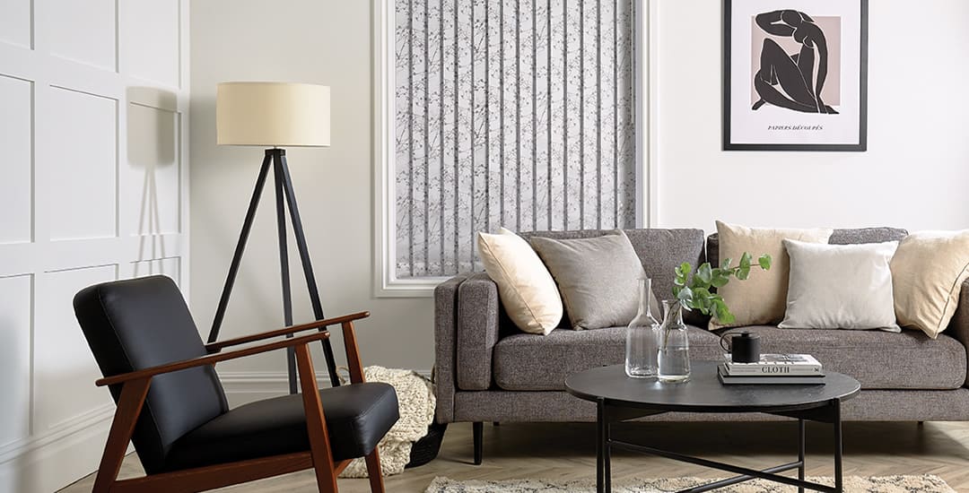 Closed silver vertical blinds in living room 