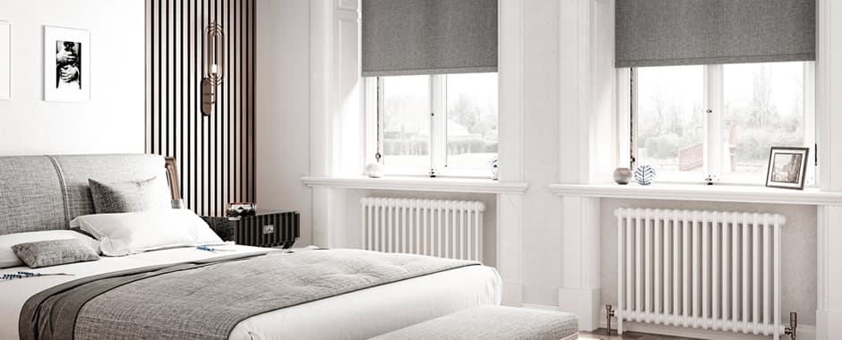 Grey textured roller blinds in luxury bedroom