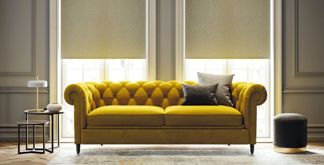 Luxury textured roller blinds in living room with yellow sofa