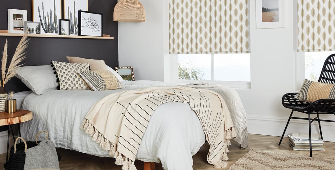 Sumptuous cream and grey bedroom with Ikat patterned roller blinds 