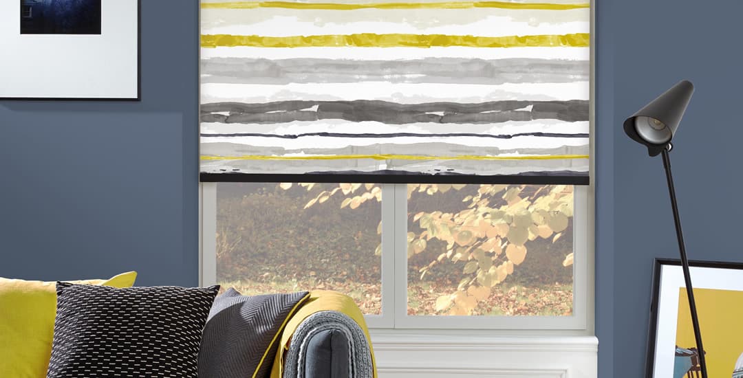 Yellow and grey wavy horizontal striped roller blinds in living room 