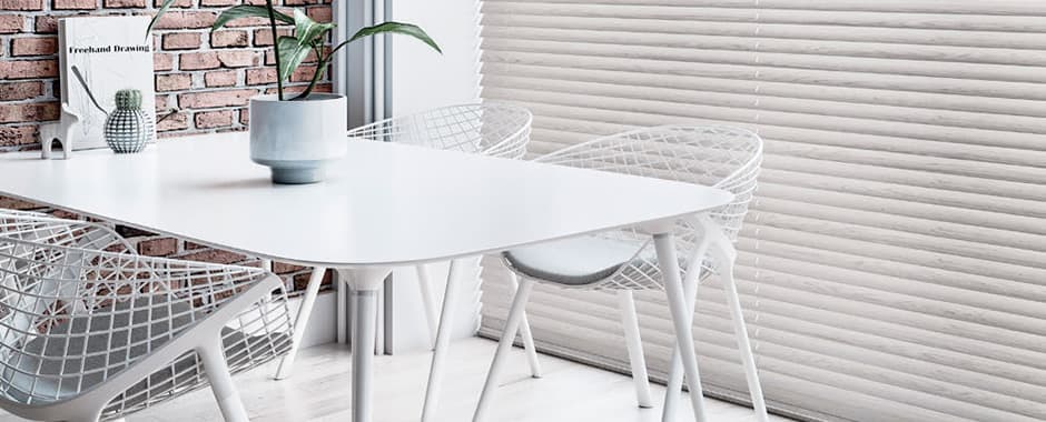 Large faux wood blinds in dining area