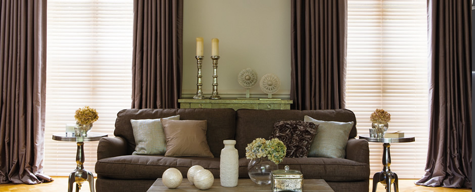 Luxury wooden blinds and curtains in traditional living room