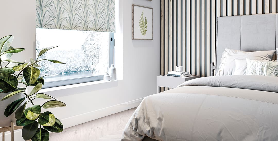 Luxury modern bedroom with tropical patterned roller blinds