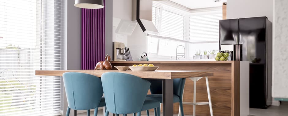 White wooden blinds in spacious kitchen