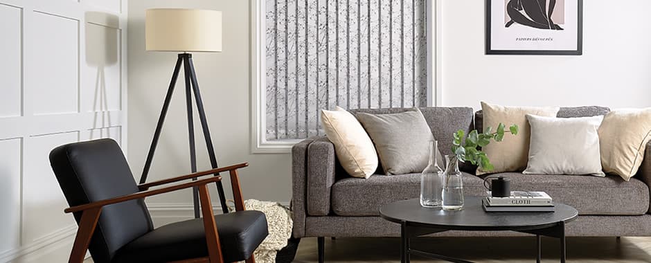 Closed silver grey vertical blinds in living room