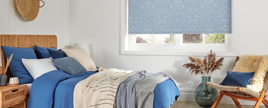 Vintage blue patterned blackout roller blinds in bedroom