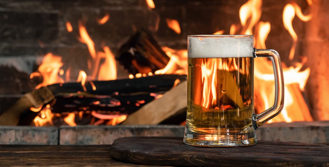 Beer on a table in front of the pub fireplace