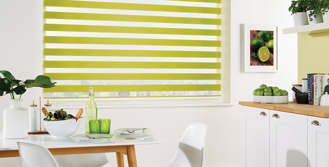 Lime green day and night vision blinds in kitchen diner