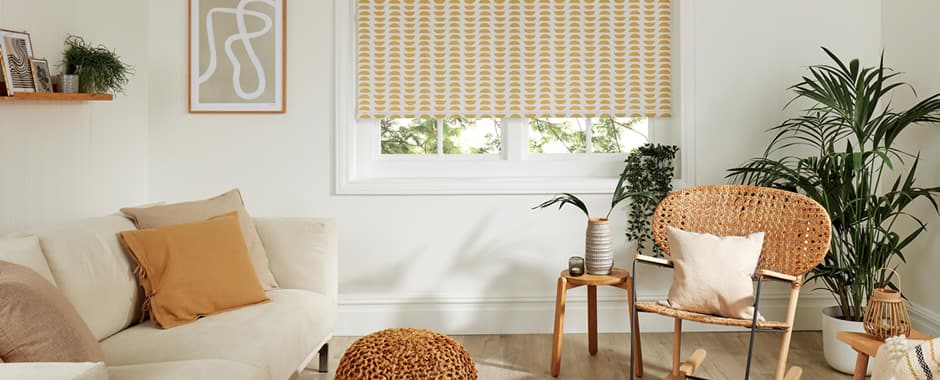 Orange and cream patterned roller blinds in living room