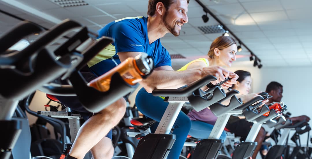 People cycling in the gym