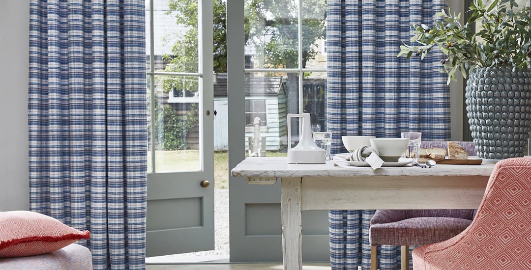 Luxury blue and white striped curtains in a country kitchen diner