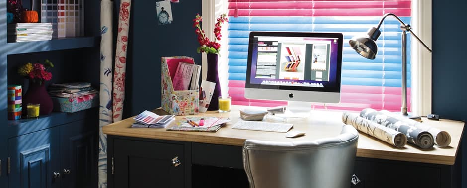 Colourful wooden Venetian blinds in dark blue home study